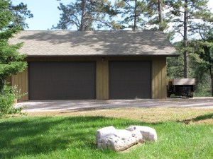 9511 Clarkson Road James & Linda Anderson 61' in front of Garage - Directly under overhead power line by white rocks